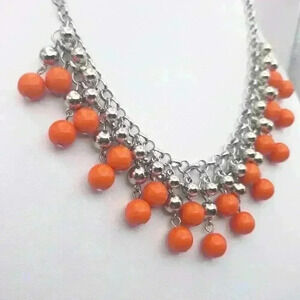 Adjustable silver tone and orange bead necklace